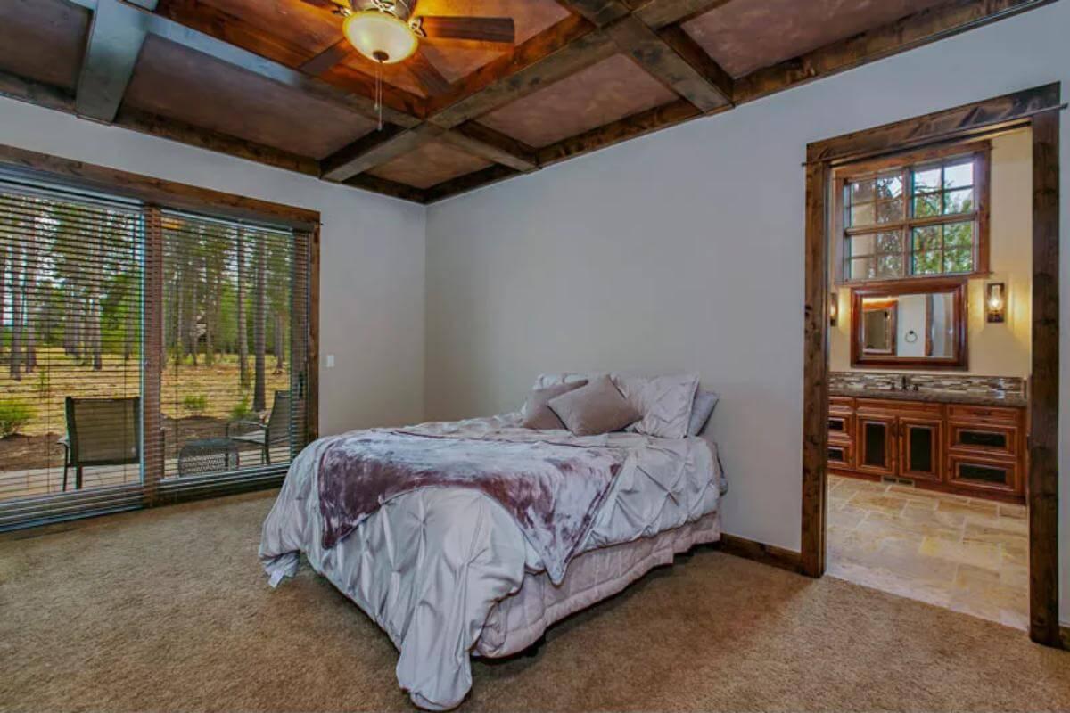 Relax in This Craftsman Bedroom With an Inviting Wood Beam Ceiling