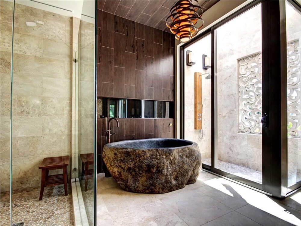 Unwind in a Nature-Inspired Bathroom with a Striking Stone Tub