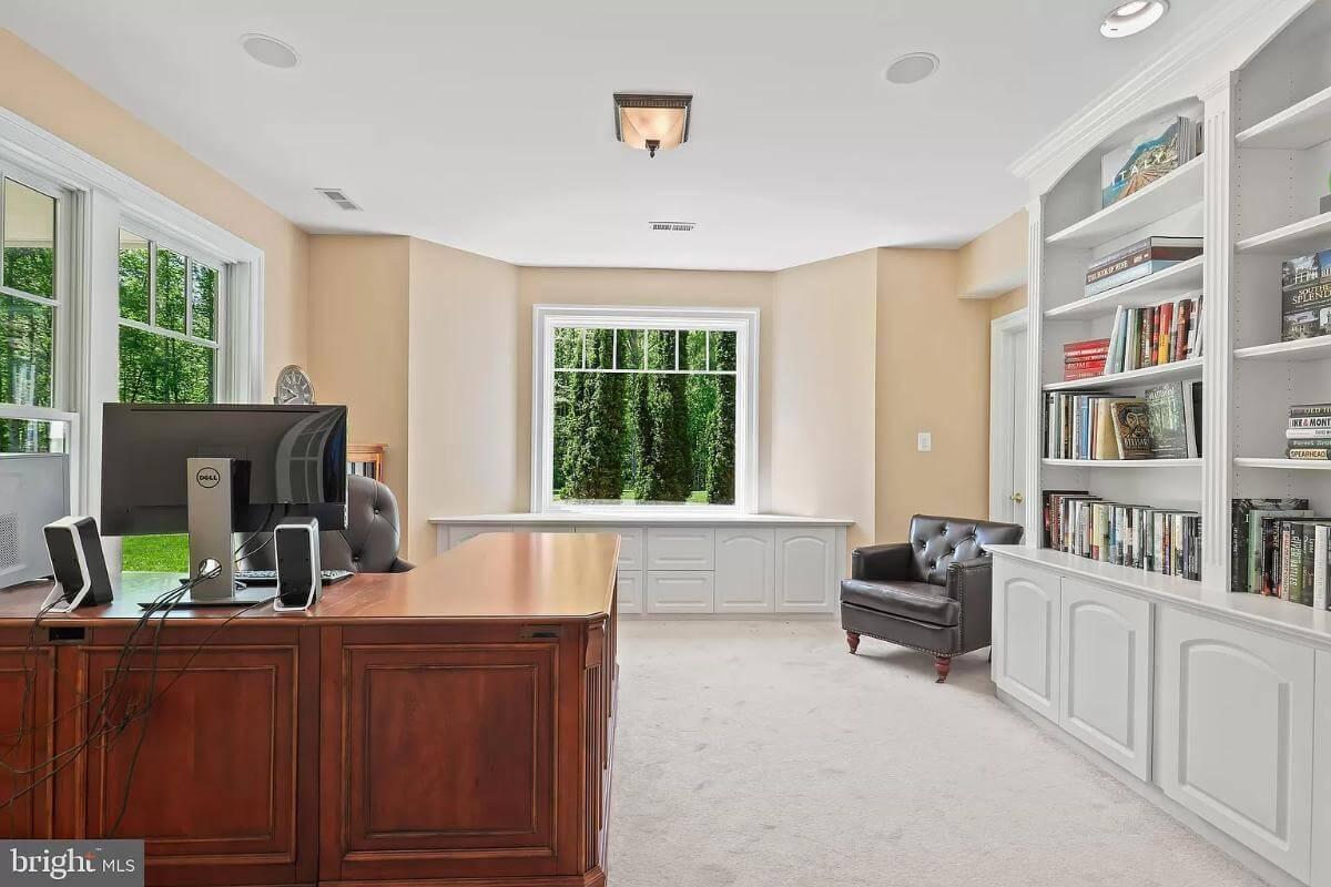 Functional Home Office with a Wall of Built-in Bookshelves