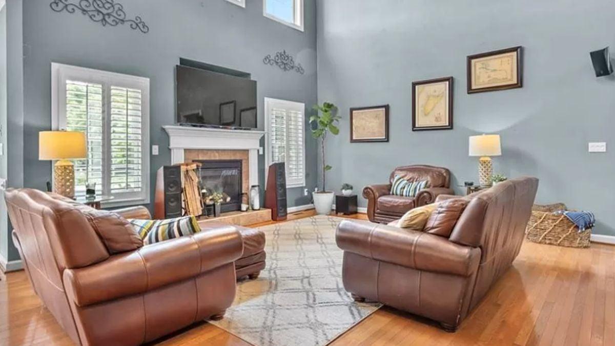 Explore This Living Room with Elegant Leather Seating and Gentle Wall Art