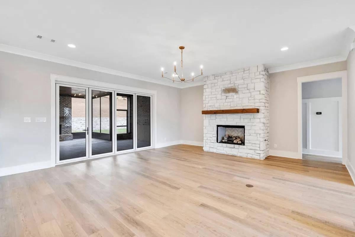 Notice the Rustic Beam Above This Modern Fireplace