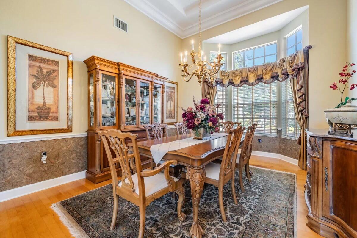 A Formal Dining Room with an Impressive Wooden China Cabinet