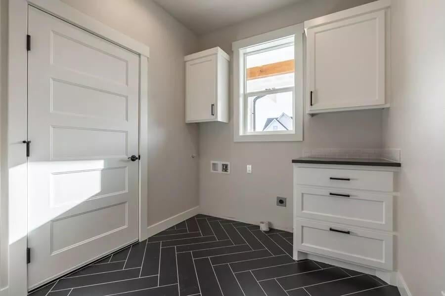 Herringbone Tile Detail in This Modern Craftsman Laundry Room