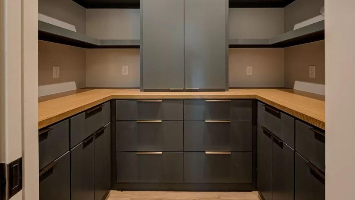 This Sleek Storage Nook Features Dark Cabinets Paired With Natural Wood