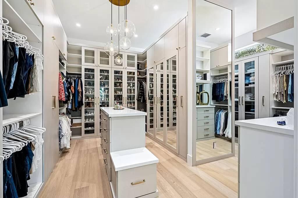 Luxurious Closet with Custom Glass-Front Cabinets