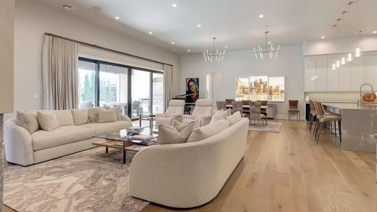 Discover the Expansive Living Area With Stunning Art and a Grand Piano