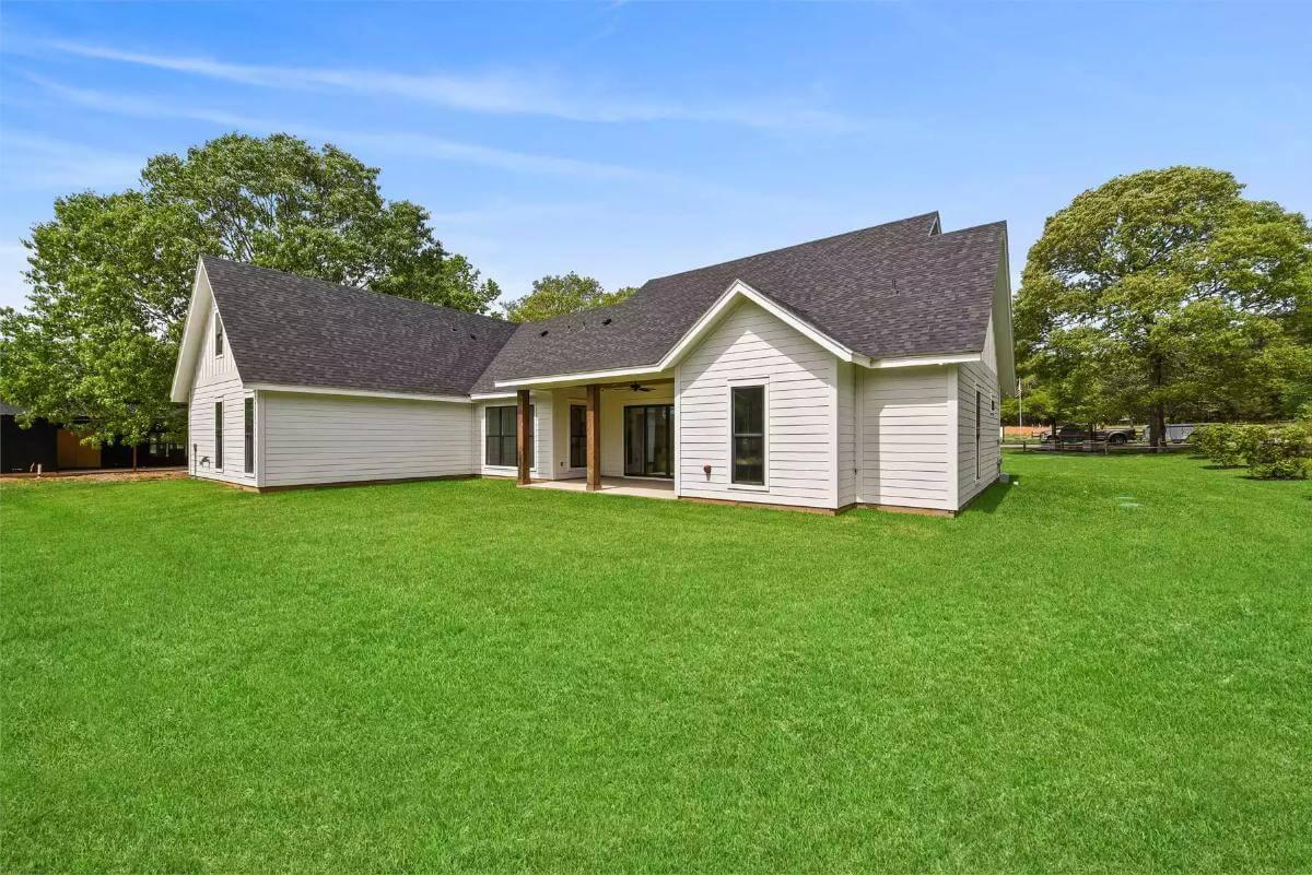 Take In the Expansive Backyard with Its Sleek Covered Patio