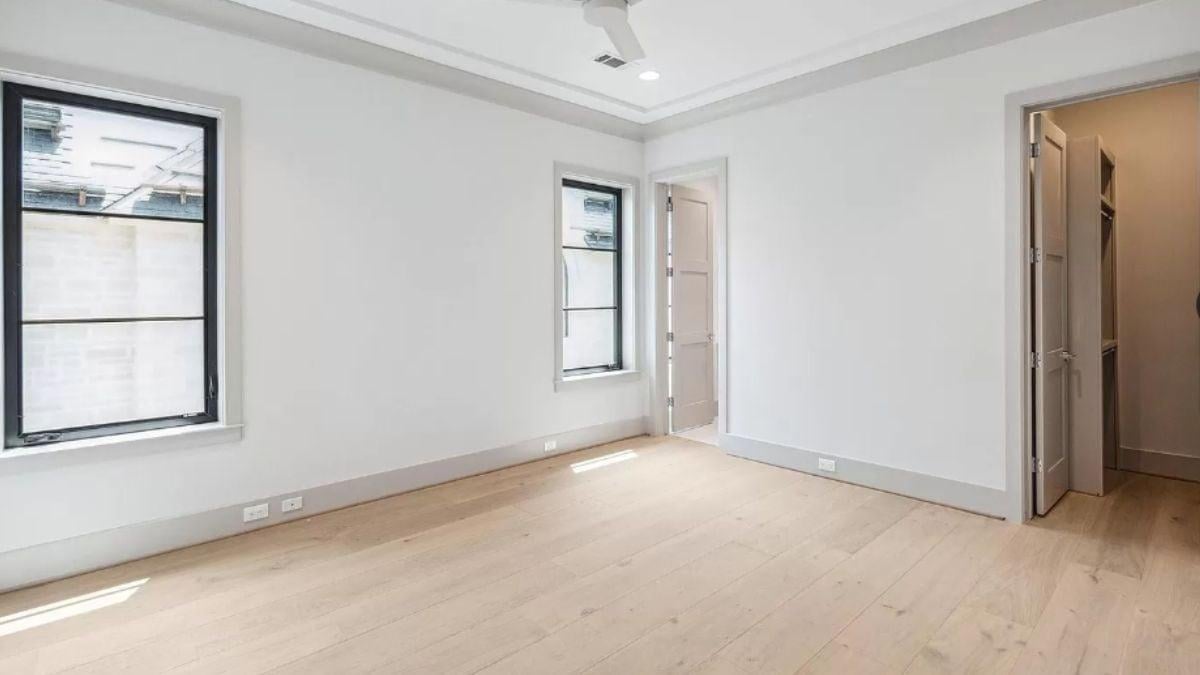Step Into This Inviting Space With Light Wood Floors and Trim Details