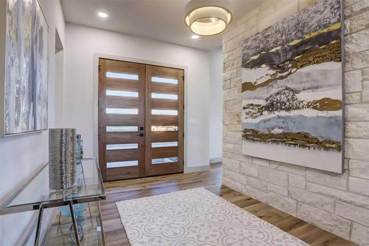 Gorgeous Entryway with Bold Wooden Doors and Stone Accent Wall