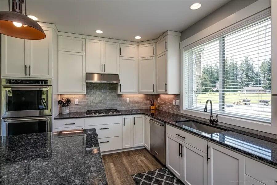 Granite Countertops and Classic White Cabinets Make This Kitchen Stand Out