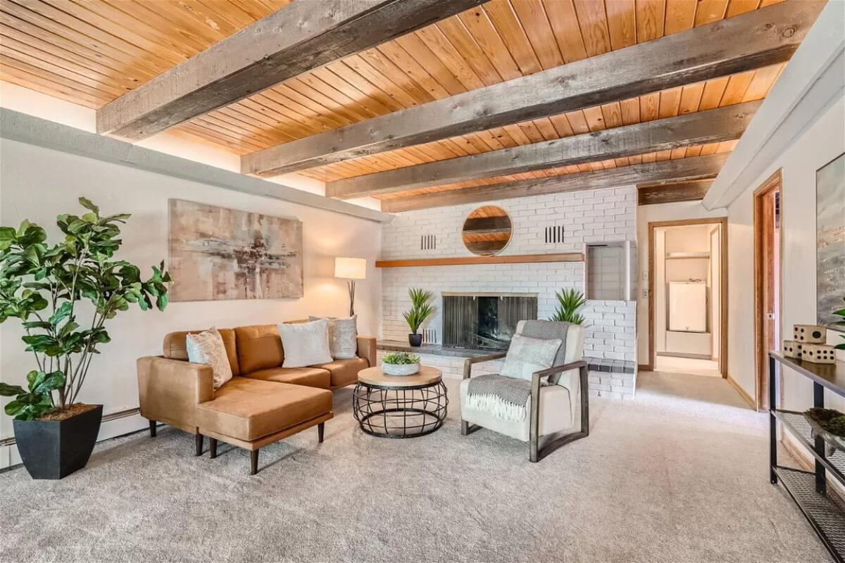 Notice the Exposed Beam Ceiling in This Cozy Living Room