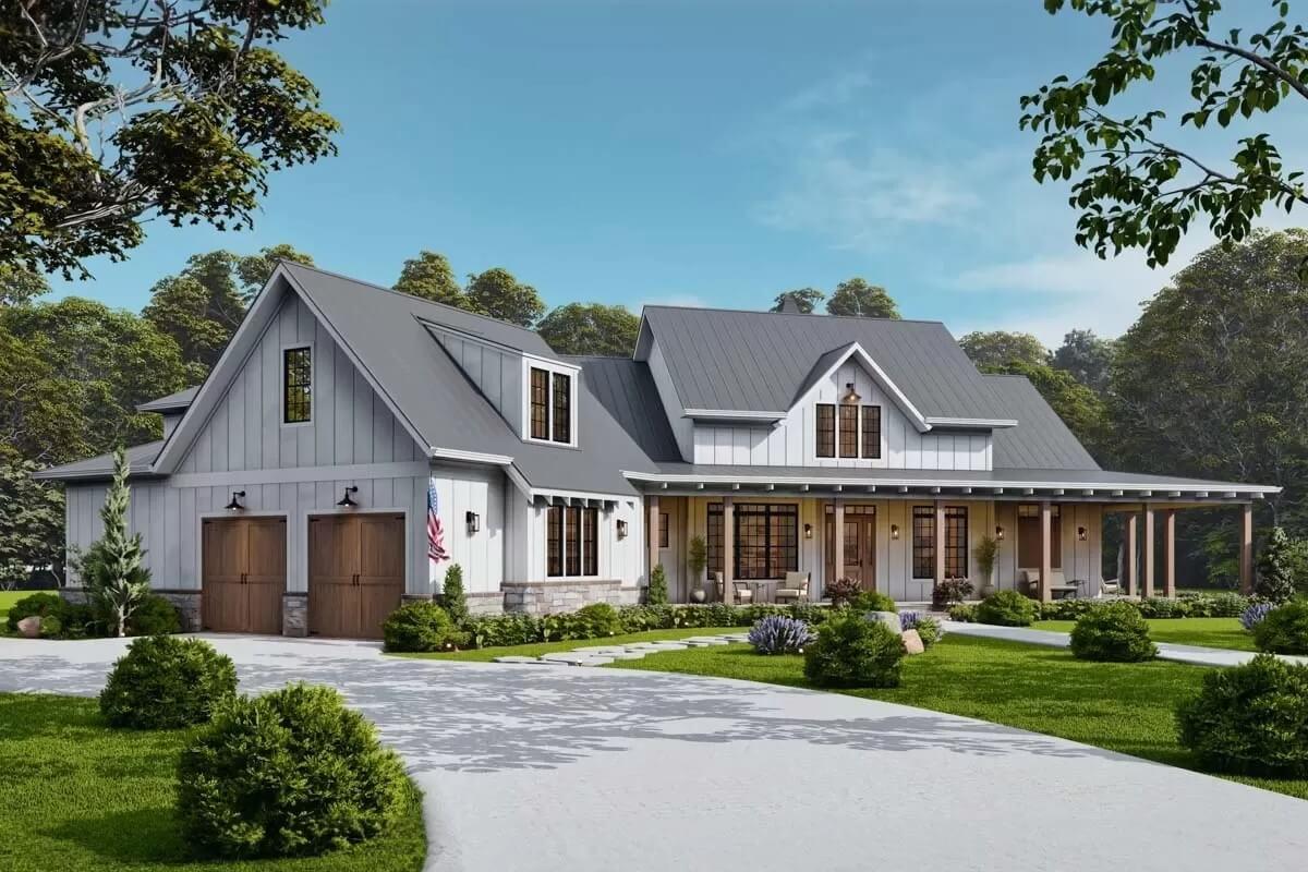 Classic Farmhouse Façade Featuring Dual Garage and Inviting Front Porch