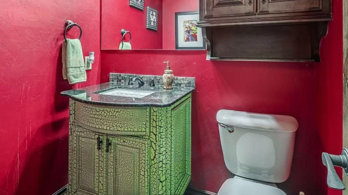 Bold Red Walls and Crackle Finish Cabinetry—A Unique Powder Room