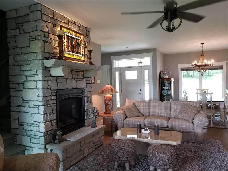 Notice the Stained Glass Highlighting This Stone Fireplace