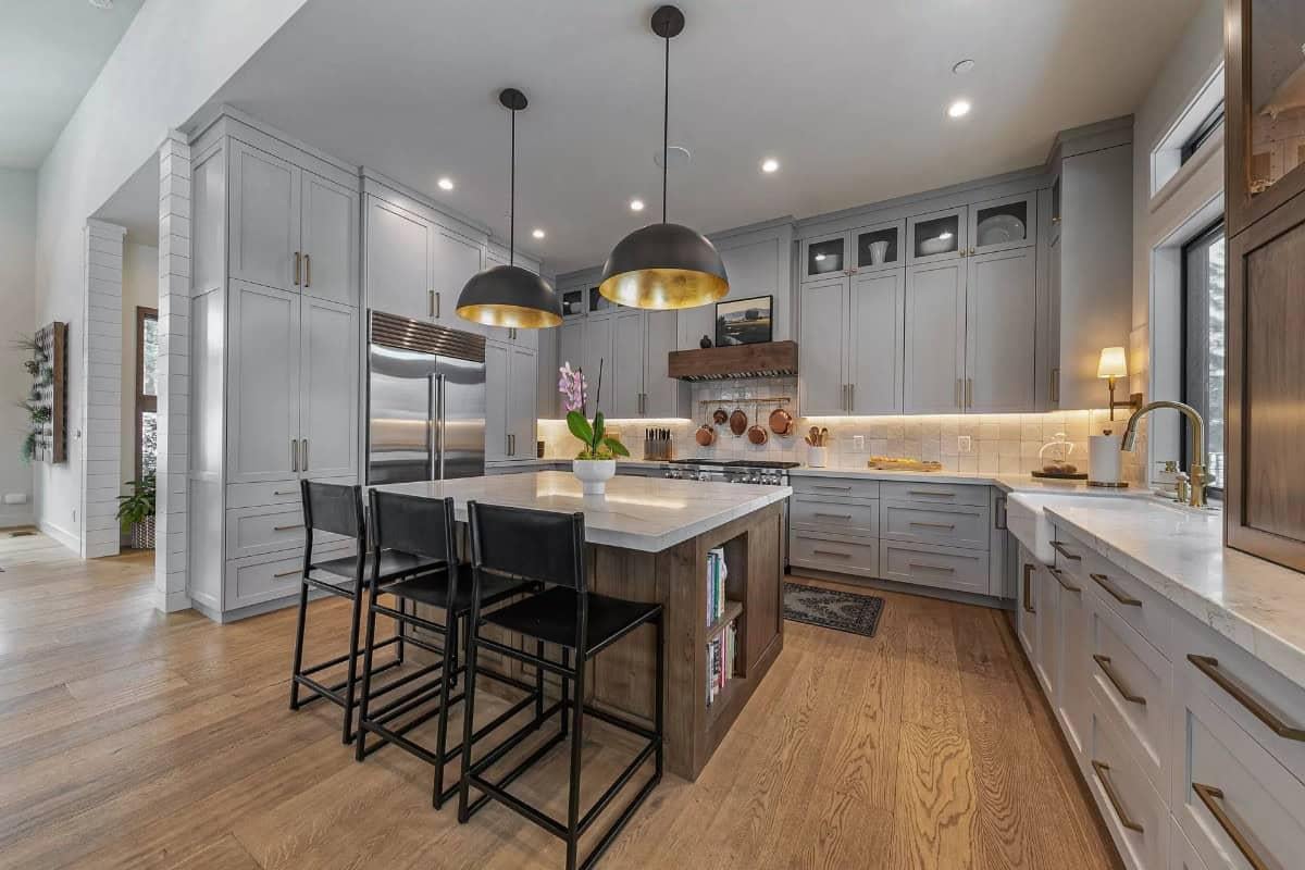 Check Out the Eye-Catching Gold-Lined Pendants in This Stylish Kitchen