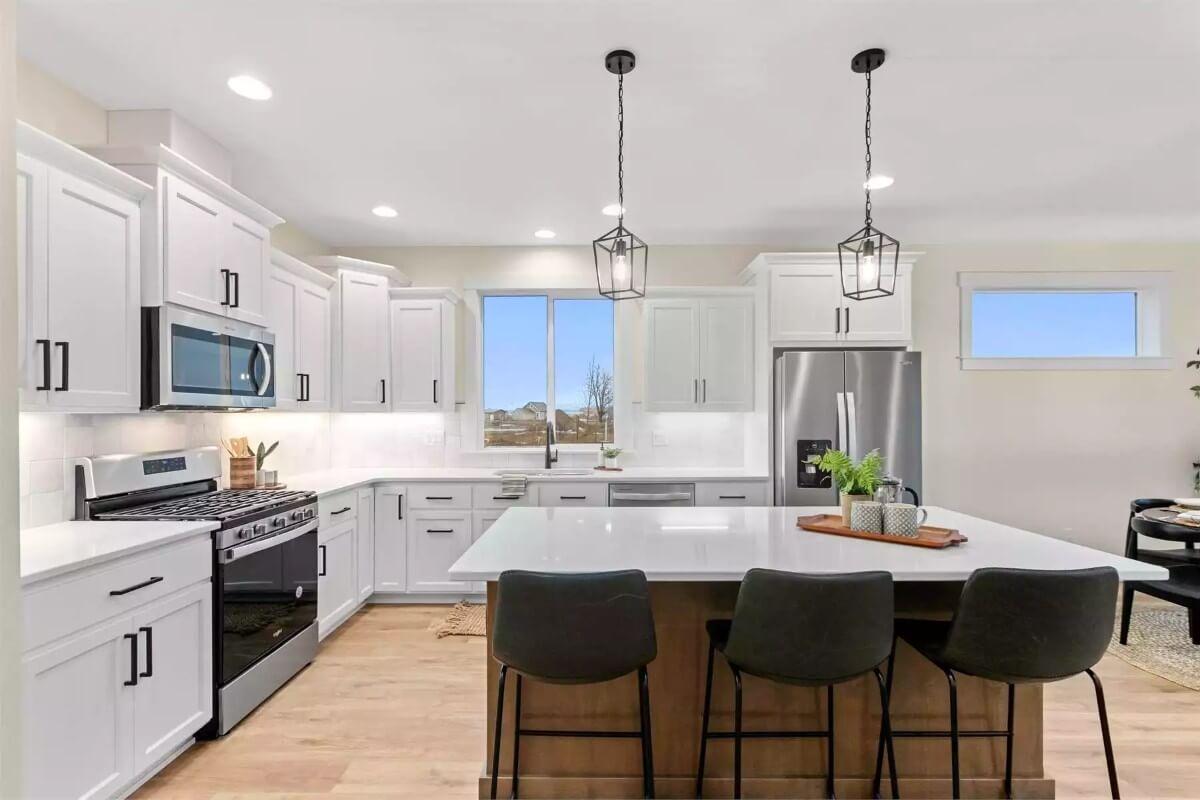 Sleek Kitchen Design with Stunning Pendant Lights Over the Island