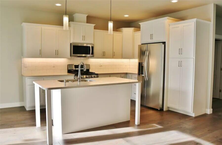 Kitchen Island Steals the Show in this Sleek Craftsman Design