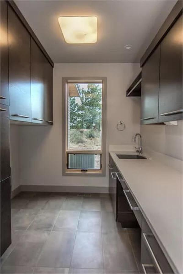 Efficient Laundry Room with a ViewโNotice the Streamlined Cabinets