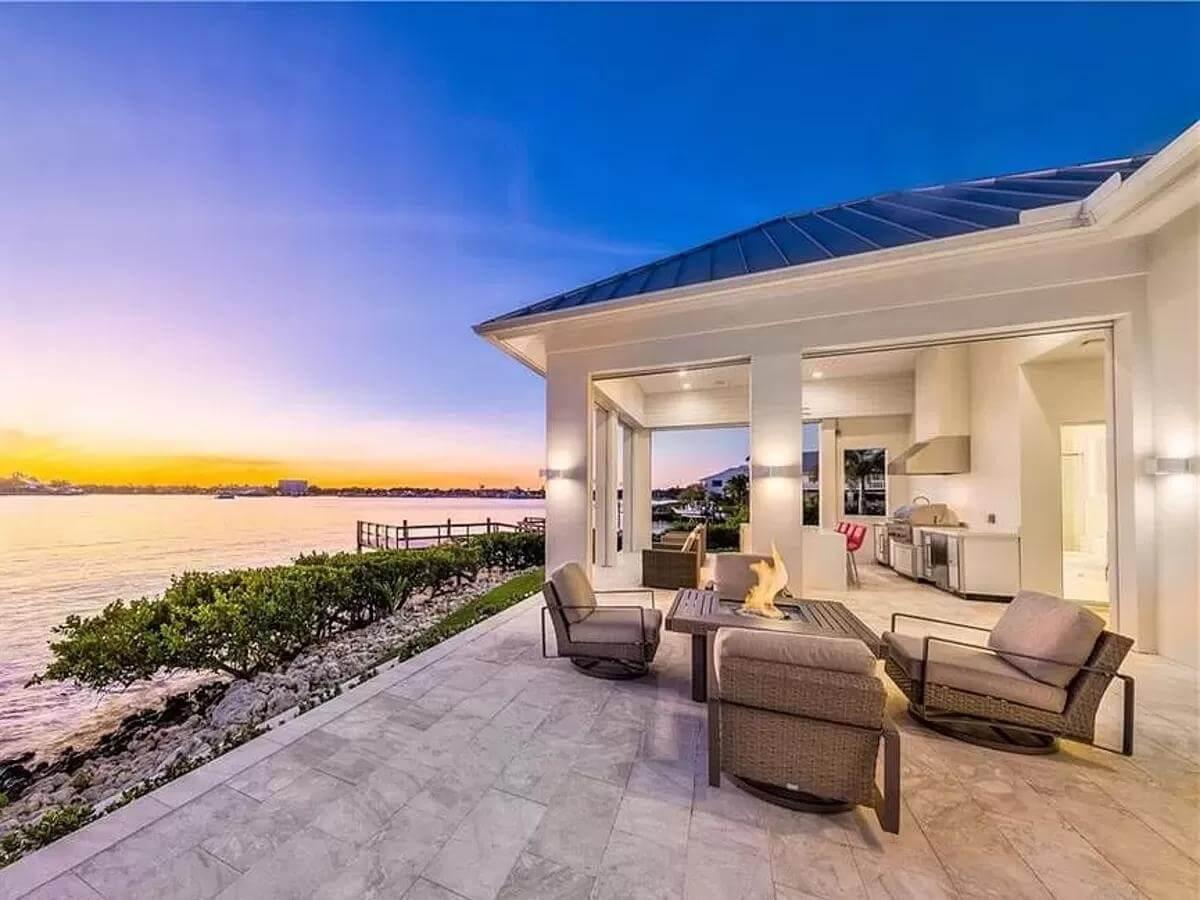 Sunset Patio Paradise with Sleek Fire Pit and Waterfront Views