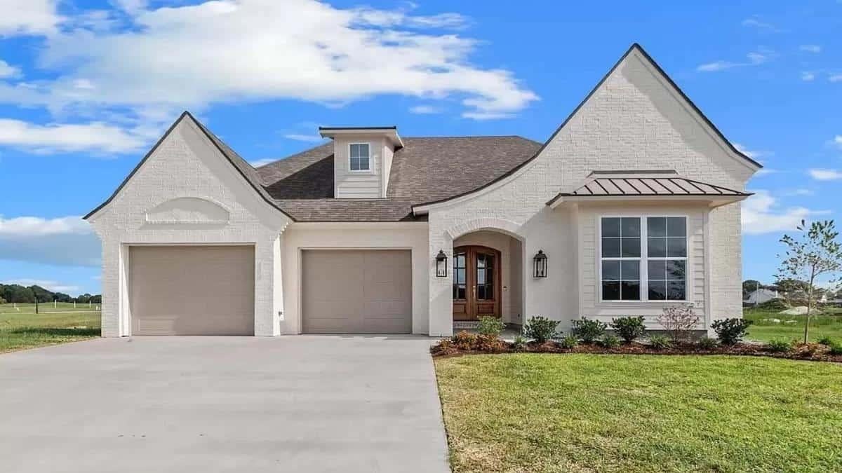 Notice the Charming Arched Entryway on This Modern Ranch Exterior