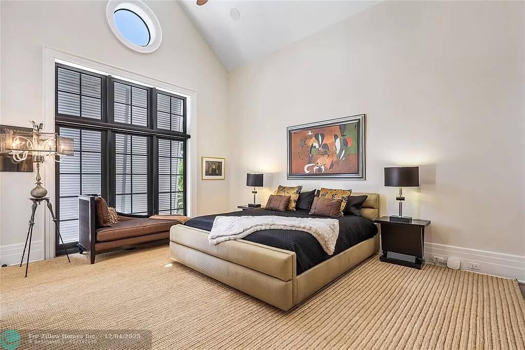 Relax in This Bedroom With Striking Black-Framed Windows