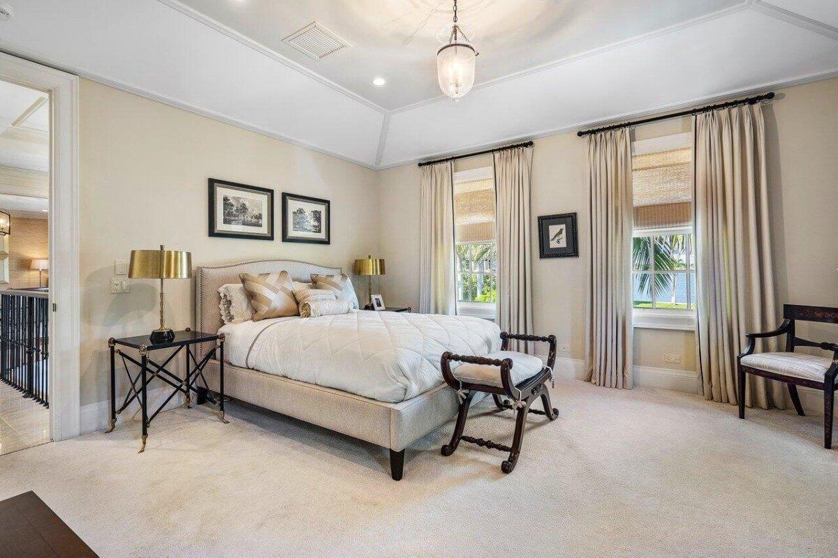 Notice the Classic Bed Frame and Elegant Drapery in This Bedroom