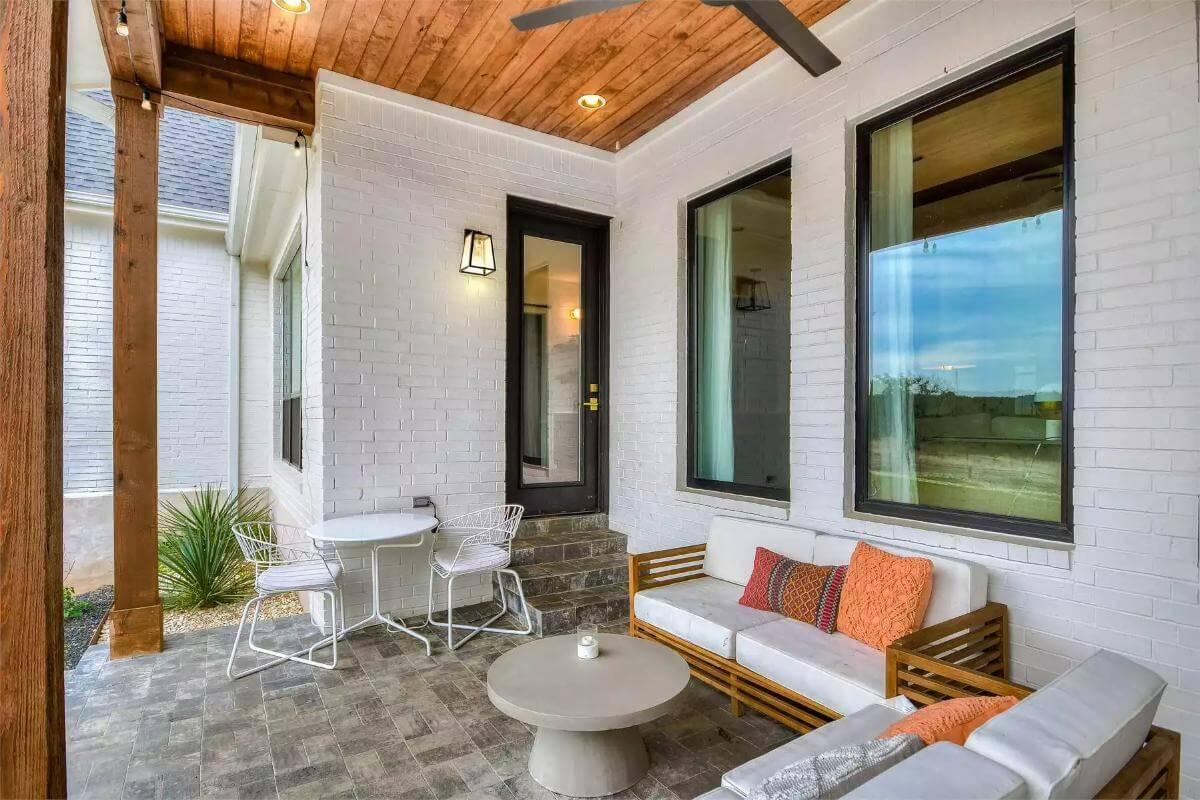 Enjoy the Sleek Simplicity of a Brick Patio with Warm Wood Accents