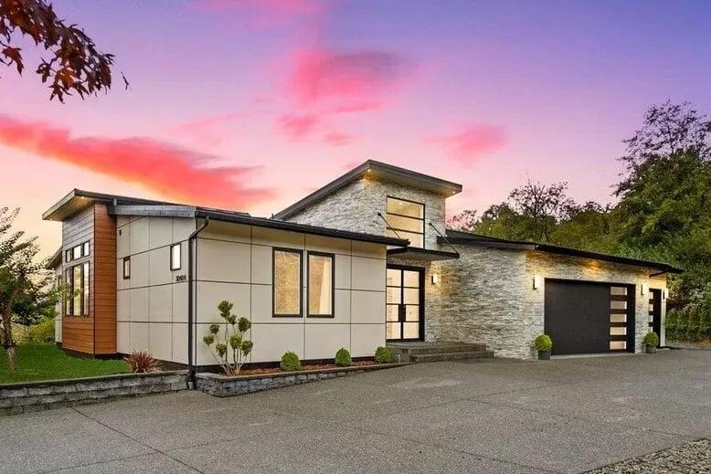 Modern Home with Striking Roofline and Stone Facade