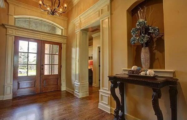 Grand Entryway With Elegant Vignette and Warm Tones