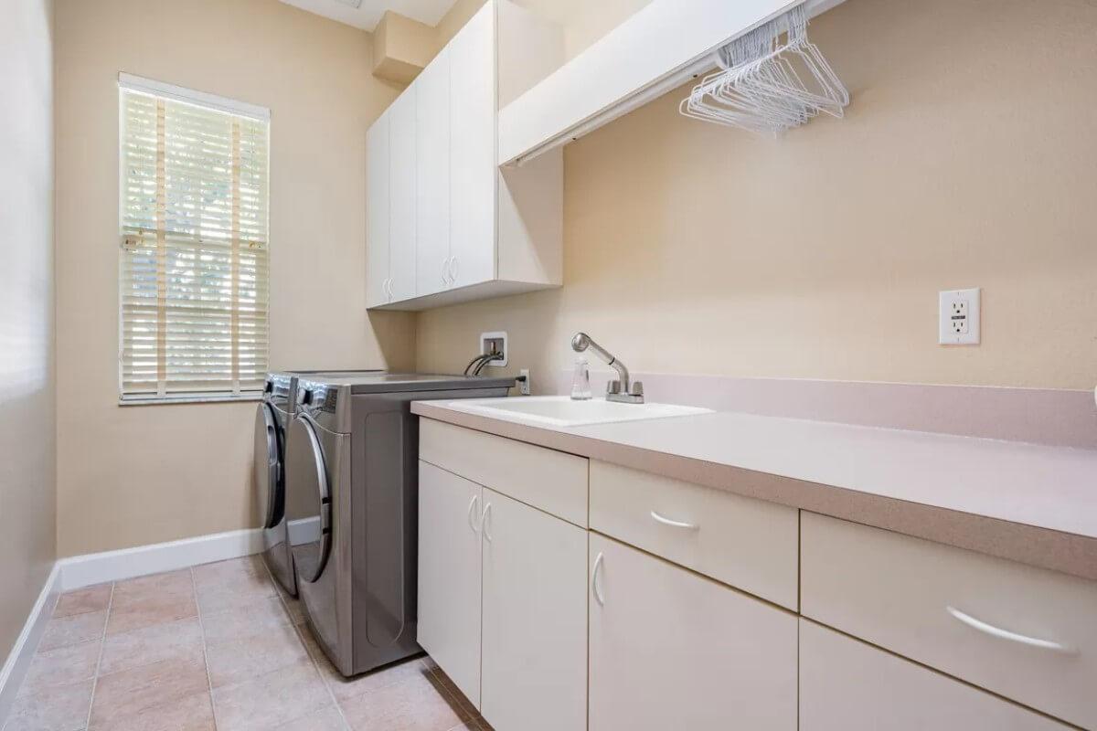 Notice the Ample Storage in This Clean and Efficient Laundry Room
