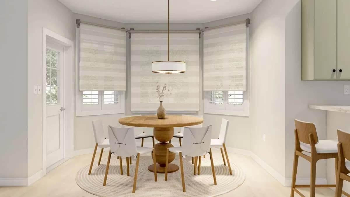 Bright Breakfast Nook with a Chic Round Table and Soft Window Treatments