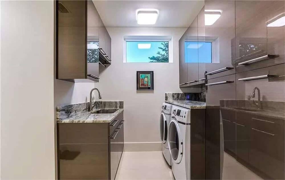 Sleek Laundry Room with High-Gloss Cabinets