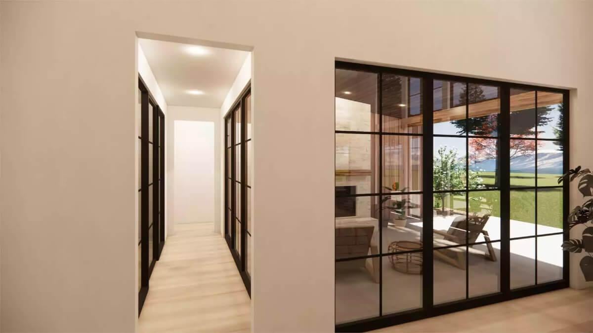 Explore the Inviting Hallway with Sleek Black-Framed Glass Doors