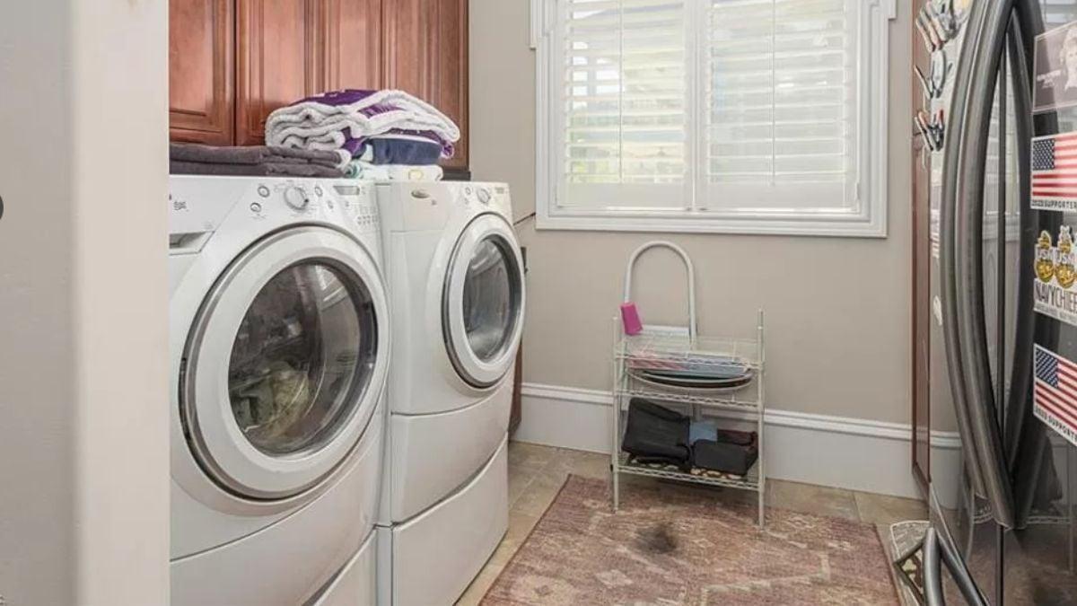 Functional Laundry Room With Front-Load Machines and Ample Storage