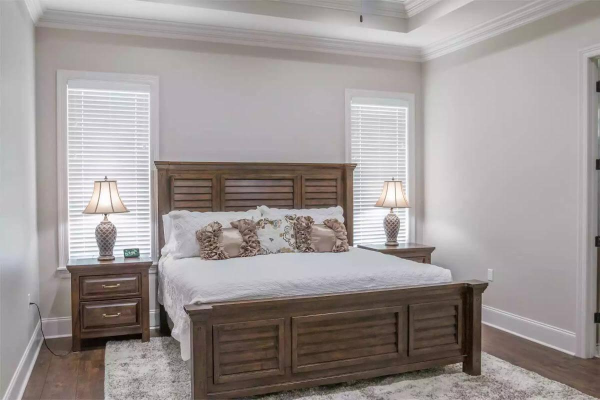 Admire the Classic Wooden Bed Frame and Subtle Elegance in This Bedroom