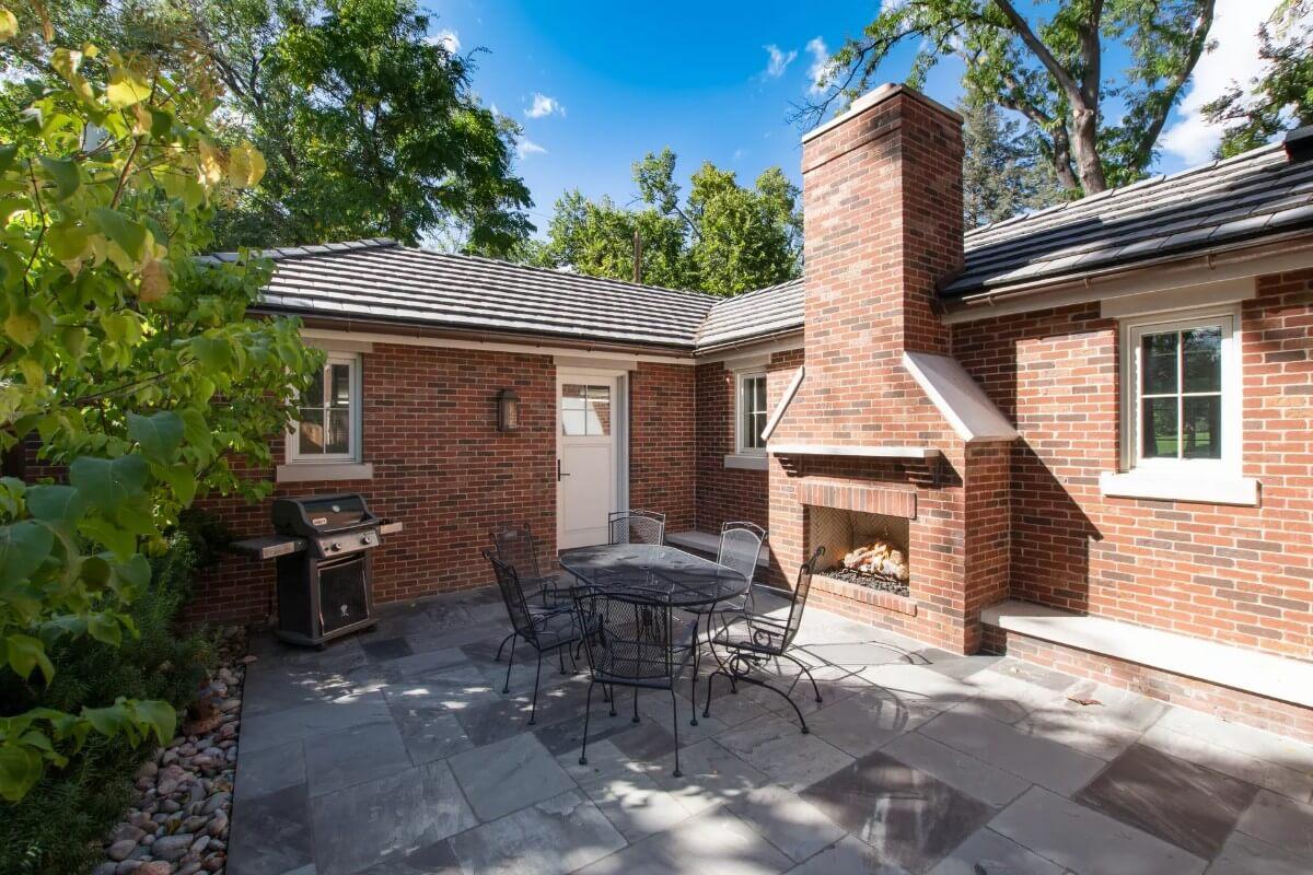 Charming Patio With Classic Brick Fireplace Perfect for Outdoor Gatherings