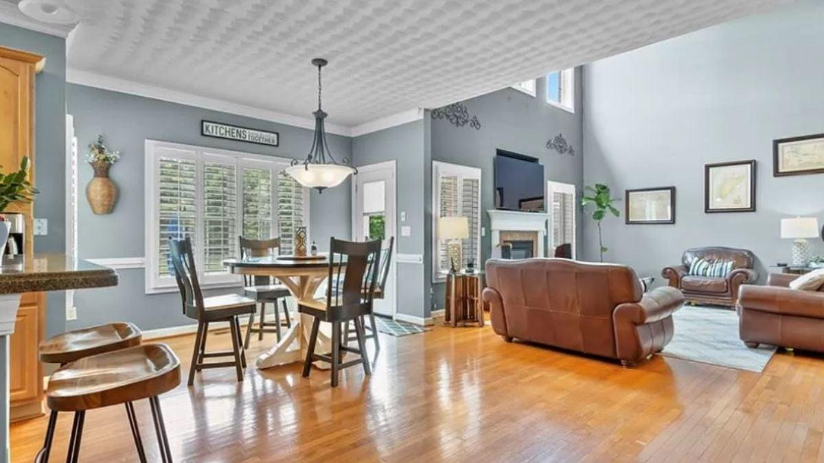 Open Layout Dining and Living Area with Leather Accents