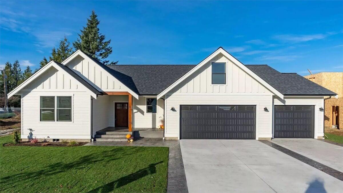 Classic Craftsman Exterior with Board and Batten Siding and Three-Car Garage