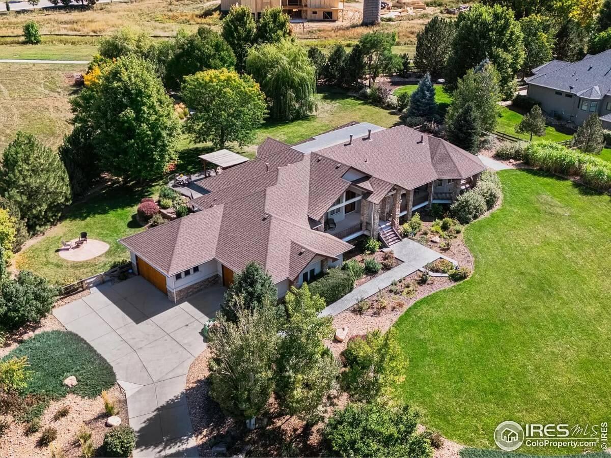 Lovely Aerial View of a Ranch Home Nestled in Lush Greenery