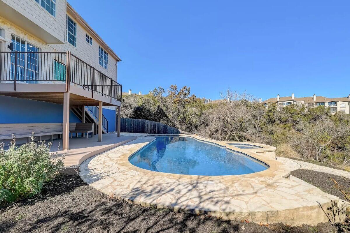 Expansive Deck Overlooking a Curved Pool—Perfect for Entertaining Outdoors