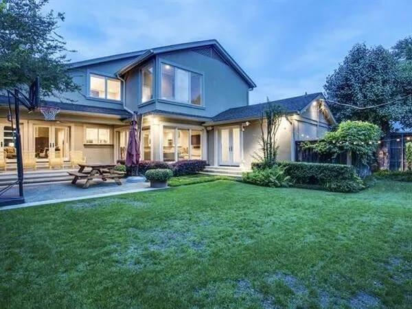 Explore This Expansive Backyard with Large Patio and Lush Lawn