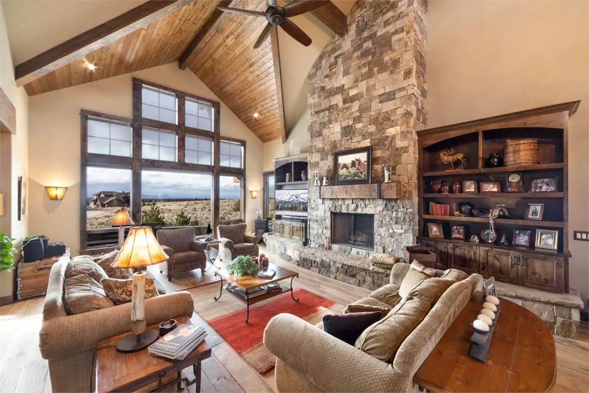 Vaulted Ceiling and Stone Fireplace Make This Living Room Feel Like a Mountain Retreat