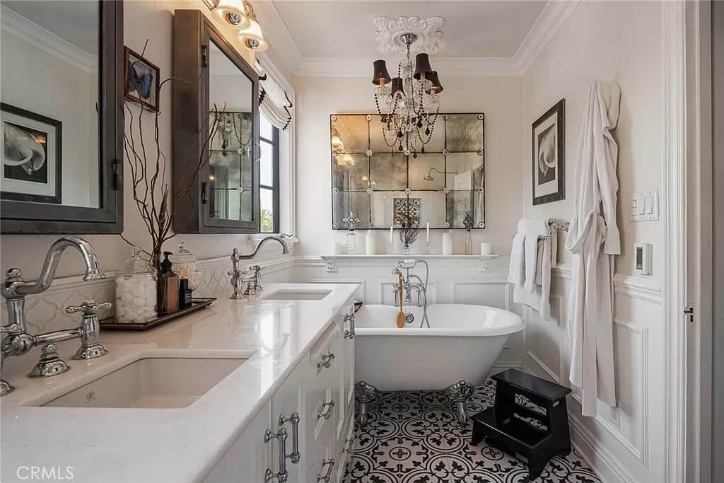 Glamorous Bathroom with Vintage Mirror and Intricate Tile Floors