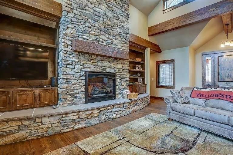 Rustic Great Room with Striking Stone Fireplace and Cozy Alcove