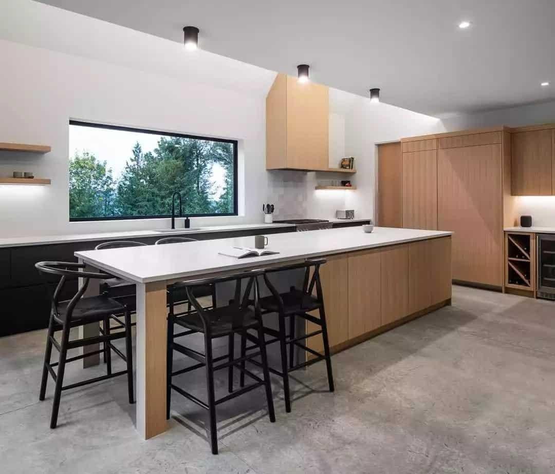 Admire the Blend of Sleek Cabinets and Expansive Window in This Kitchen