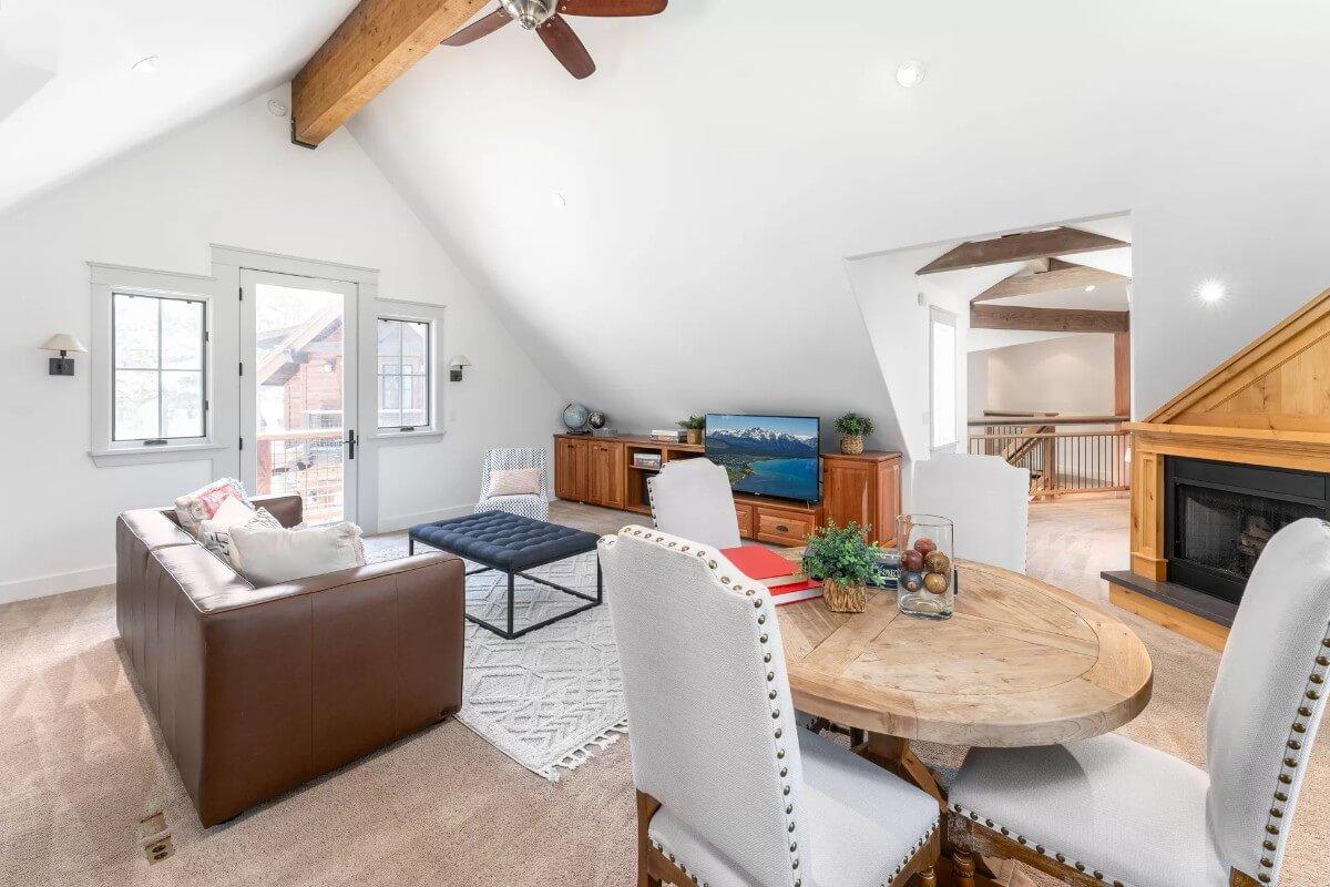 Check Out the Vaulted Ceiling and Cozy Fireplace in This Bright Loft Space