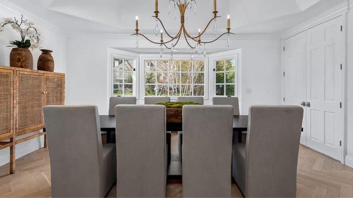 Elegant Dining Room with Woven Cabinet and Bay Window