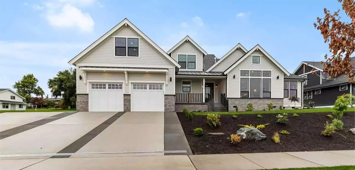 This Charming Home Greets You with a Double Garage and Gabled Rooflines