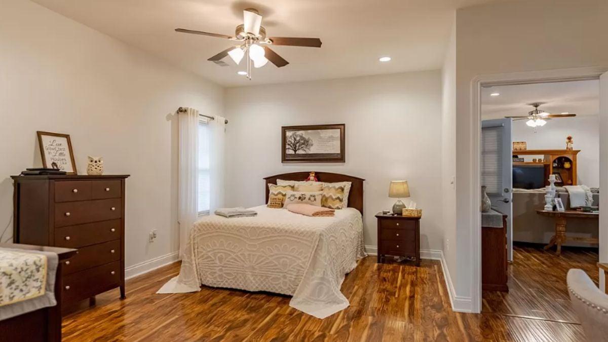Cozy Bedroom with Warm Wooden Flooring and Simple Elegance