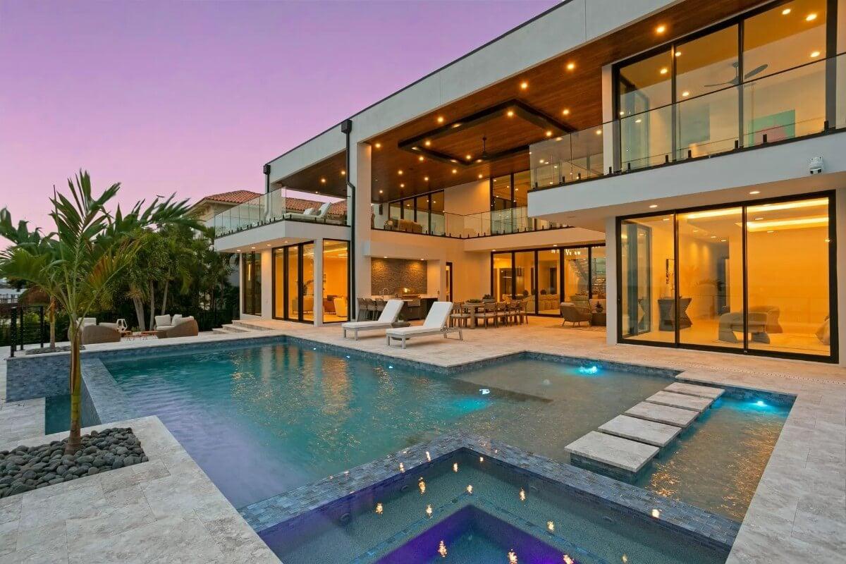 Stunning Infinity Pool with Ambient Lighting and Outdoor Living Space